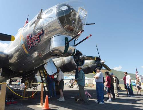 Al Hartmann |  The Salt Lake Tribune
People tour a restored B-17 Flying Fortress at the Heber City Airport Tuesday, June 8, 2015. The B-17, dubbed Sentimental Journey, is one of several restored vintage WW II planes on display. Sentimental Journey is giving tours and rides for a fee through Sunday.