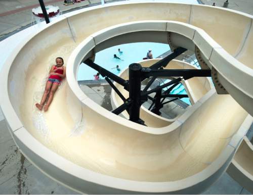 Steve Griffin  |  The Salt Lake Tribune

Youngsters enjoy the water slide at the Taylorsville Recreation Center Tuesday, June 9, 2015. Salt Lake County Health Department (SLCoHD) held its annual Healthy Swim Season media day to remind residents to practice healthy swimming behaviors and dispel a few pool myths.