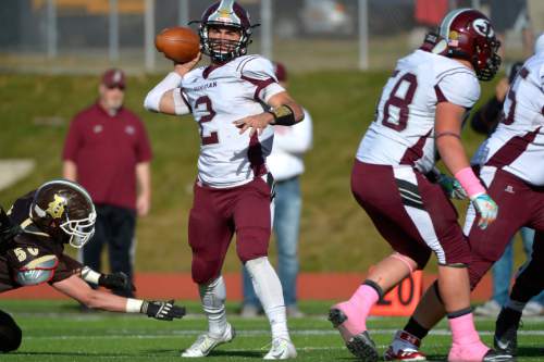 Chris Detrick  |  The Salt Lake Tribune
Jordan's Austin Kafentzis (2) passes the ball during the game at Davis High School Friday October 31, 2014.