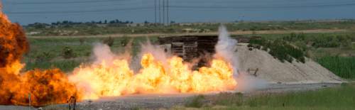 Steve Griffin  |  The Salt Lake Tribune


Explosive devices ignite in sequence as they are detonated by ATF agents during an explosive safety training exercise open to the media at the Salt Lake Airport Police Training Center in Salt Lake City, Thursday, June 11, 2015.