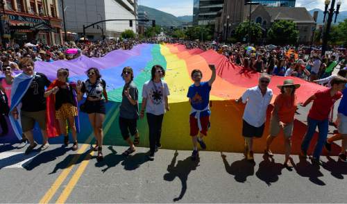 Francisco Kjolseth  |  The Salt Lake Tribune
The large rainbow flag closes out the Pride Parade, Utah's second-largest parade, after the Days of '47, and by far the most colorful, as it is marched through the streets of downtown Salt Lake on Sunday, June 7, 2015.