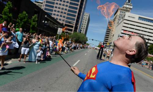 Francisco Kjolseth  |  The Salt Lake Tribune
Dustin Everett with the Voodoo float swallows fire during the Pride Parade, Utah's second-largest parade, after the Days of '47, and by far the most colorful, on the streets of downtown Salt Lake on Sunday, June 7, 2015.
