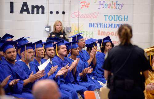Al Hartmann |  The Salt Lake Tribune
Utah State Prison inmates from South Park Academy attend a graduation commencement ceremony Wednesday June 10, 2015. Family members attended just like any graduation but with the addition of corrections guards.  About 150 men and women serving time at the prison received diplomas at the ceremony.