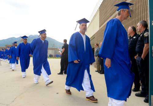 Al Hartmann |  The Salt Lake Tribune
Male inmates at the Utah State Prison in Draper walk to the auditiorium for a graduation commencement ceremony from South Park Academy. About 150 men and women serving time at the prison received diplomas at the ceremony on Wednesday June 10, 2015.