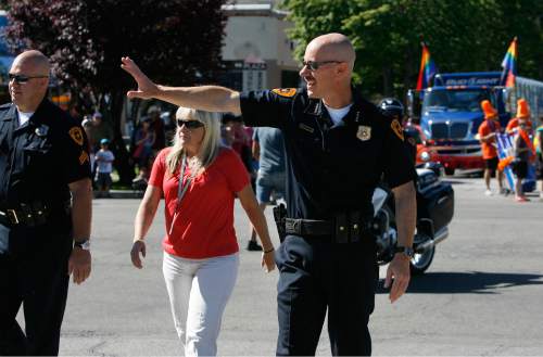 Scott Sommerdorf   |  The Salt Lake Tribune

Salt lake Police Chief Chris Burbank waves to the crowd near the front of The Utah Pride Parade as the parade begins it way through the streets of downtown Salt Lake City, Sunday, June 2, 2013.