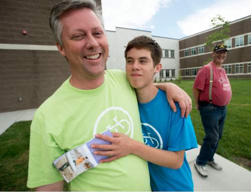 Steve Griffin  |  The Salt Lake Tribune


Steven Palmer, with his 16-year-old son Elijah smile for a photograph as they participate with forty people with special needs, ranging from age 7 to 35, as they learn to ride bicycles for the first time at a camp being conducted this week at Summit Academy High School in Bluffdale, Thursday, June 11, 2015.  Steven and his wife Sally Palmer organized the camp called Ride to New Heights, and the local sponsor is the non-profit, United Angels Foundation, which supports families and parents of children with special needs. They've brought in the national non-profit, I Can Shine that provide  instructors and special bikes that help those with disabilities learn to balance and, ultimately, ride on their own.