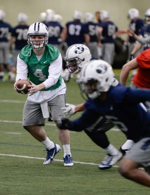 Francisco Kjolseth  |  The Salt Lake Tribune 
BYU football opens spring camp on Monday, March 2, 2015, as quarterback Tayson Hill joins the indoor practice at the Smith Fieldhouse.