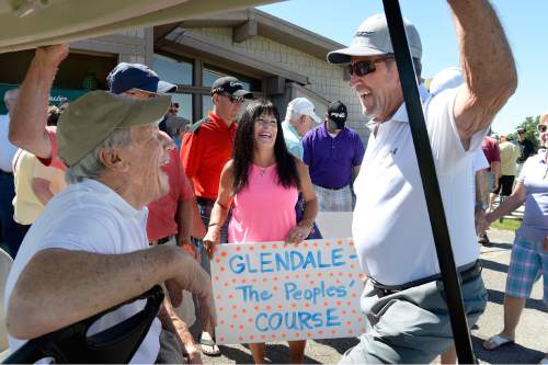 Scott Sommerdorf   |  The Salt Lake Tribune
Longtime Glendale golf pro Tim Reese, left, tells stories to pass time prior to the beginning of a rally to save Glendale Golf Course, organized by mayoral hopeful Jackie Biskupski, Saturday, June 13, 2015. Earlier this year, the City Council voted to turn the links into a park that would have various functions, including soccer, football and baseball.