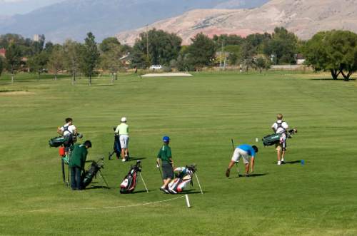 Al Hartmann  |  The Salt Lake Tribune
Golfing group takes off at Glendale Golf Course in Salt Lake City Monday September 26.