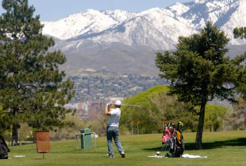 Al Hartmann |  The Salt Lake Tribune  5/4/2010
Golfer practices his swing on the driving range  at Glendale Golf Course located at 1600 West and 2100 South in Salt Lake City.