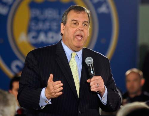 In this Thursday, April 23, 2015, file photo, New Jersey Gov. Chris Christie addresses a gathering during a town hall meeting, in Cedar Grove, N.J. Federal prosecutors have announced a court proceeding, scheduled for Friday, May 1, 2015, involving the 2013 traffic jams on the George Washington Bridge, an investigation that has loomed over Christie as he considers a presidential run. (AP Photo/Mel Evans, File)