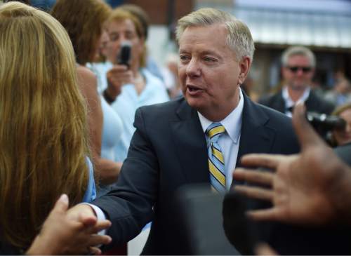 In this photo taken June 1, 2015, Republican presidential candidate, Sen. Lindsey Graham, R-S.C. greets supporters in Central, S.C. Graham introduced a bill Thursday banning most late-term abortions and is predicting the Senate will vote on the highly polarizing issue this year. (AP Photo/Rainier Ehrhardt)