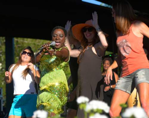 Leah Hogsten  |  The Salt Lake Tribune
Sharon Jones of Sharon Jones & the Dap Kings invited many people on stage prior to headliner blues-rock band Tedeschi Trucks Band during their sold out show during the Wheels of Soul 2015 Summer Tour, at Red Butte Garden, Friday, June 12, 2015.