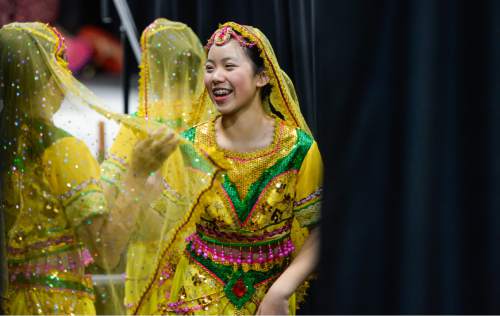 Francisco Kjolseth  |  The Salt Lake Tribune
Megan Zeng, 13, with the Leah Dance Company gets ready to take to the stage for the 38th Annual Asian Festival that celebrates Asian cultures with dance, music, food and more at the South Towne Expo Center on Saturday, June 13, 2015. This year the festival features Utah's Bhutanese, Cambodian, Chinese, Filipino, Indian, Indonesian, Japanese, Korean, Laotian, Taiwanese, Thai, Tibetan and Vietnamese communities.