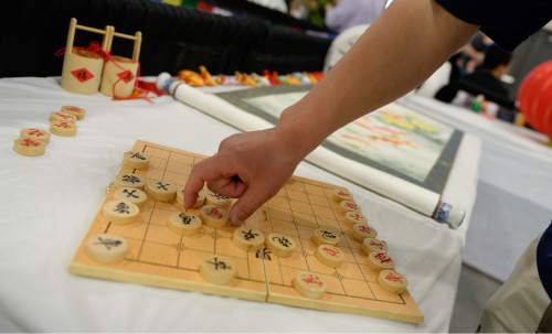 Francisco Kjolseth  |  The Salt Lake Tribune
People play a friendly game of Chinese chess during the 38th Annual Asian Festival that celebrates Asian cultures with dance, music, food and more at the South Towne Expo Center on Saturday, June 13, 2015. This year the festival features Utah's Bhutanese, Cambodian, Chinese, Filipino, Indian, Indonesian, Japanese, Korean, Laotian, Taiwanese, Thai, Tibetan and Vietnamese communities.