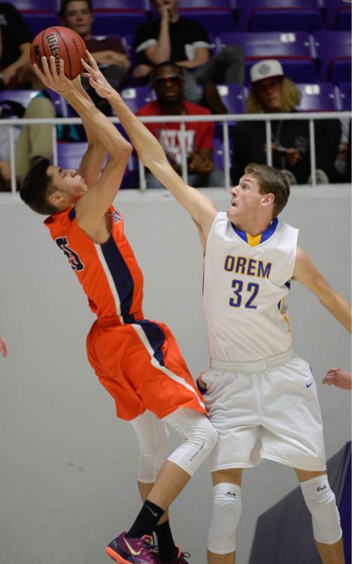Francisco Kjolseth  |  The Salt Lake Tribune 
Timpview's Gavin Baxter (25) gets swatted by Orem's Joshua Carlile (32) in 4A boys' hoops quarterfinal at the Dee Events Center in Ogden on Thursday, Feb. 26, 2015.