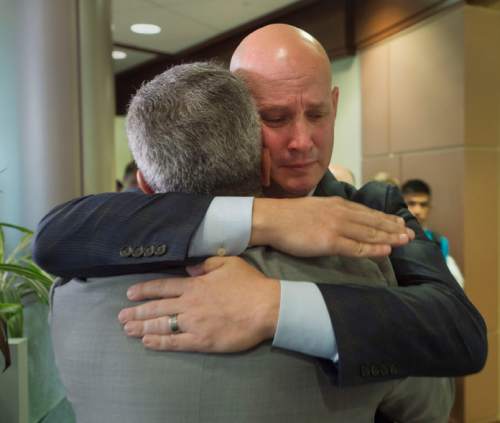 Steve Griffin  |  The Salt Lake Tribune

Sigma Chi Fraternity philanthropy committee chairman Dan Shaver, right, hugs Michael Greenberg, grand consul of Sigma Chi Fraternity, following a press conference announcing the fraternity's commitment to raise $10 million for cancer research at the Huntsman Cancer Institute (HCI), pledging to be "The Generation to End Cancer." This is believed the largest gift committed to one charity in men's fraternity history. To acknowledge the commitment, the sixth floor of Huntsman Cancer Hospital will be named "The Sigma Chi International Fraternity Sixth Floor." The gift is a gesture of Sigma Chi's vision of friendship, justice, and learning to ease the suffering of cancer patients and their families at the Huntsman Cancer Hospital in Salt Lake City, Monday, June 15, 2015.