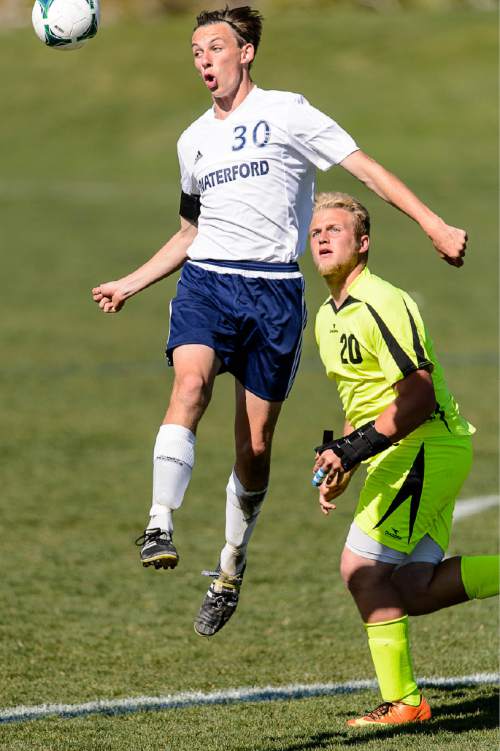 Trent Nelson  |  The Salt Lake Tribune
Waterford's Jesse Sindelar leaps up to the ball, with Diamond Ranch's Corey Lewis at right as Waterford hosts Diamond Ranch in the 2A high school soccer playoffs, Wednesday April 29, 2015.