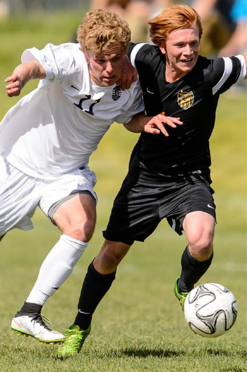 Trent Nelson  |  The Salt Lake Tribune
Skyline's Brigham Jackson (11) and Wasatch's Jaden Hills (1) race for the ball during a first round Class 4A soccer state game between Wasatch and Skyline High School, in Salt Lake City, Wednesday May 13, 2015.