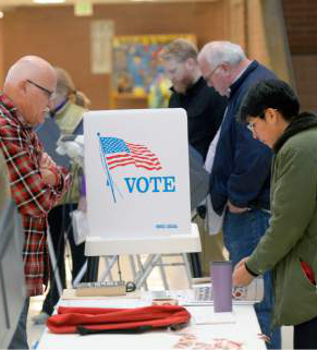 Al Hartmann  |  The Salt Lake Tribune
Voting booths were full in early morning voting at precinct SLC 108 at Hawthorne Elementary School in Salt Lake City Tuesday November 4.