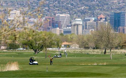 Al Hartmann |  The Salt Lake Tribune  5/4/2010
Golfers at Glendale Golf Course located at 1600 West and 2100 South in Salt Lake City get a view of the downtown skyline.