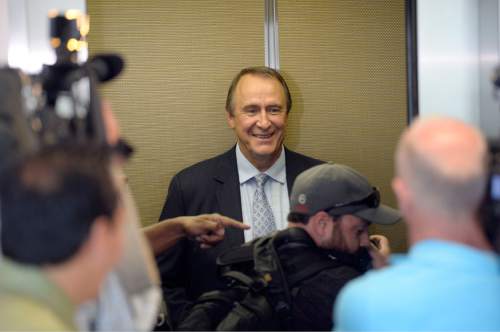 Al Hartmann |  The Salt Lake Tribune
Former Utah Attorney General Mark Shurtleff,  watches as media photographers climb aboard elevator with him at Matheson Courthouse after his prleiminary hearing in Salt Lake City Monday June 15. a