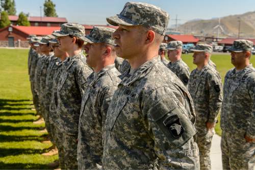 Trent Nelson  |  The Salt Lake Tribune
Fifty-three Utah Guardmembers sing a song after being realigned to the 101st Airborne Division (Air Assault) in an "Old Abe" patch ceremony at Camp Williams in Bluffdale, Friday June 19, 2015.