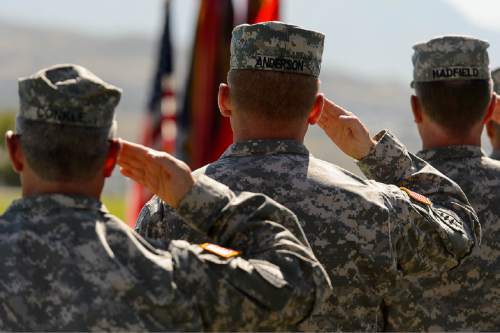 Trent Nelson  |  The Salt Lake Tribune
Fifty-three Utah Guardmembers are realigned to the 101st Airborne Division (Air Assault) in an "Old Abe" patch ceremony at Camp Williams in Bluffdale, Friday June 19, 2015.