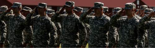 Trent Nelson  |  The Salt Lake Tribune
Fifty-three Utah Guardmembers are realigned to the 101st Airborne Division (Air Assault) in an "Old Abe" patch ceremony at Camp Williams in Bluffdale, Friday June 19, 2015.