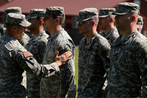 Trent Nelson  |  The Salt Lake Tribune
Fifty-three Utah Guardmembers are realigned to the 101st Airborne Division (Air Assault) in an "Old Abe" patch ceremony at Camp Williams in Bluffdale, Friday June 19, 2015.
