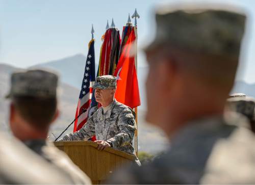 Trent Nelson  |  The Salt Lake Tribune
Major General Jefferson Burton speaks as fifty-three Utah Guardmembers are realigned to the 101st Airborne Division (Air Assault) in an "Old Abe" patch ceremony at Camp Williams in Bluffdale, Friday June 19, 2015.