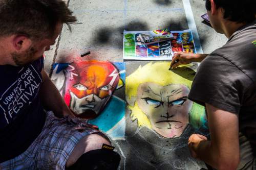Chris Detrick  |  The Salt Lake Tribune
John Prue and Jason Lemmon, of Salt Lake City, use chalk to draw The Flash and Aquaman during the 13th Annual Utah Foster Care Chalk Art Festival at The Gateway Friday June 19, 2015.  The festival draws more than 100 artists creating art at The Gateway to increase attention on how people can help change the lives of the 2,700 Utah children in foster care. The festival's artwork will be on display through Sunday.