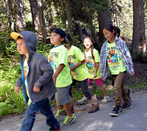 Al Hartmann |  The Salt Lake Tribune
Native American children go on a nature walk at the Native American Church of North America's Youth Conference, part of its national conference at Redman Campground in Little Cottonwood Canyon Thursday June 18. The conference is expected to have 400 Native American children and their families attend the conference, which includes members from around the country and Canada.