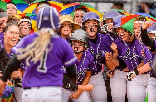 Trent Nelson  |  The Salt Lake Tribune
Lehi players celebrate as Stefani Zimmerman rounds the bases on a home run during a 5A softball tournament second-round game between defending champion Lehi and No. 1 seed Taylorsville, Thursday May 14, 2015.