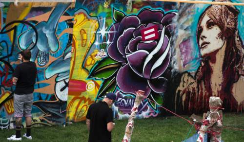Steve Griffin  |  Tribune file photo

Artists try their hand at graffiti during the opening day of the 2014 Arts Festival in Salt Lake City. This year's festival is open daily through Sunday at Library Square.