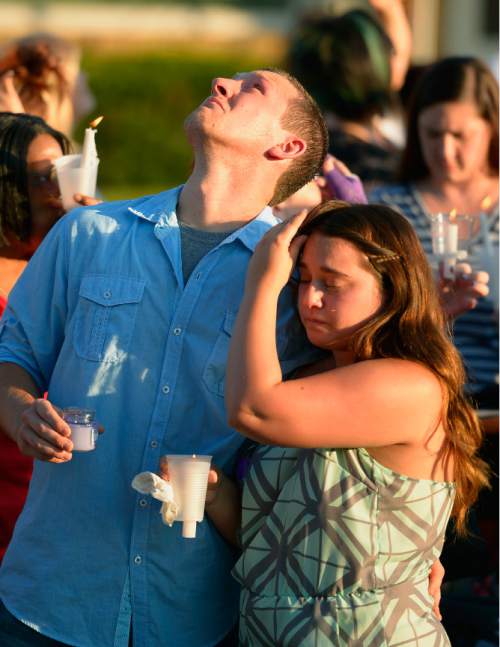 Leah Hogsten  |  The Salt Lake Tribune
Shawna Smith's brother Steven Judd looks to the sky as balloons are released into the sky. Friends of Russell and Shawna Smith hold a candlelight vigil for their friends, Tuesday, June 23, 2015, on the Smith's lawn. On Father's Day, police found the couple and their two children, Tylee, 6 and Blake, 2, dead inside their house. Police believe Russell Smith killed his wife and children and then himself.