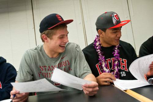 Chris Detrick  |  The Salt Lake Tribune
Wood Cross linebacker Sean Barton opted to attend Stanford and served a two-year LDS mission to Benin and Togo after signing a national letter of intent (seen here with then-teammate and future Utah defensive tackle Filipo Mokofisi) but not enrolling. By rule, he was off-limits to schools for the first year, but his father, Carl, says a handful of schools reached out and some wanted his contact information. Stanford asked Sean to sign a second NLI earlier this year, with just a few months of service left.