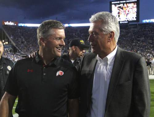 Rick Egan  | The Salt Lake Tribune 

Utah coach, Kyle Whittingham is greeted by Dieter F. Uchtdorf, before before BYU faced The University of Utah, at Lavell Edwards Stadium, Saturday, September 21, 2013. Whittingham said Utah will never attempt to recruit an LDS missionary while they're in the field, even if NCAA rules allow it after one year in most cases. He and safeties coach Morgan Scalley keep a regular correspondence with Utah's own missionaries, he said, and keep the football talk to a minimum.