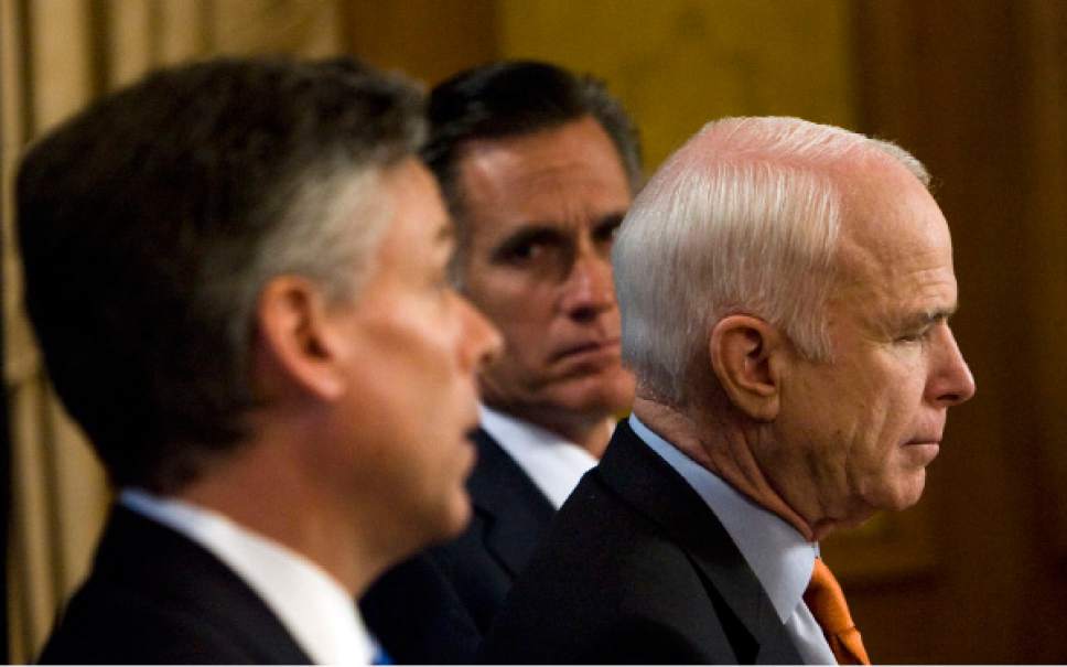 Steve Griffin  |  Tribune file photo
Arizona Senator John McCain (right)  answers questions from the media during a stop at the Grand America Hotel in Salt Lake City for a fundraiser in 2008. McCain was joined by Utah Governor Jon Huntsman (left) and Mitt Romney (center) at the event.