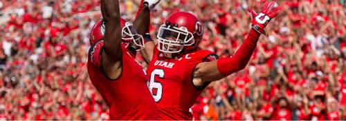 Trent Nelson  |  The Salt Lake Tribune
Utah Utes wide receiver Dres Anderson (6) celebrates a touchdown with teammate Kenneth Scott, left, as Utah hosts Fresno State, college football at Rice-Eccles Stadium Saturday September 6, 2014.