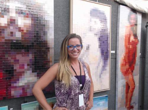 Sean P. Means  |  The Salt Lake Tribune

Dallas artist Jennifer Lashbrook stands amid her pixel-twisting pictures, which she makes from hardware-store paint samples, Thursday at the Utah Arts Festival.