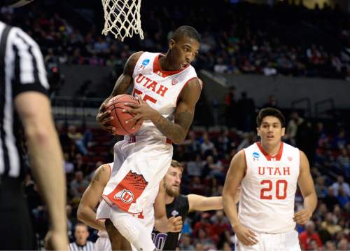 Scott Sommerdorf   |  The Salt Lake Tribune
Utah guard Delon Wright (55) grabs a rebound during first half play. Utah held a 26-19 lead over Stephen F. Austin at the half at the Moda Center in Portland, Thursday, March 19, 2015.