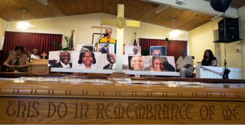 Steve Griffin  |  The Salt Lake Tribune


Photos of the nine victims in the shootings in Charleston, South Carolina are displayed during prayer vigil at the Embry Chapel African Methodist Episcopal Church in Ogden, Utah Friday, June 19, 2015. Each victim was remembered by nine interfaith religious leaders during the service.