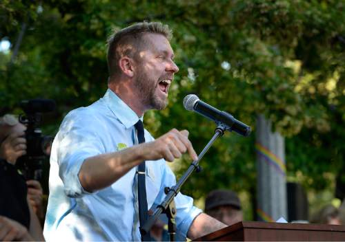 Scott Sommerdorf   |  The Salt Lake Tribune
Troy Williams speaks at a rally in City Creek Park to celebrate the SCOTUS ruling, Friday, June 26, 2015.