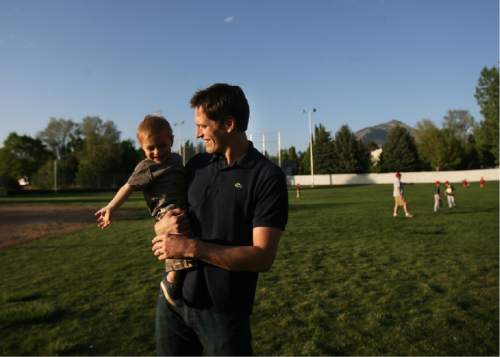 Kim Raff | The Salt Lake Tribune

Josh Romney with his son Owen Romney as the family spends time together at another son's baseball practice at an LDS stake house in Holladay, Utah on May 3, 2012.