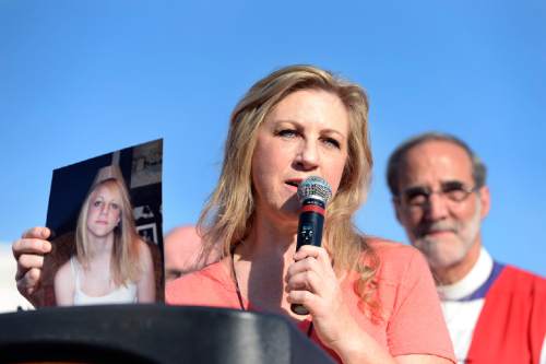 Scott Sommerdorf   |  The Salt Lake Tribune
Carolyn Tuft holds a photo of her 15 year old daughter Kirsten who was killed in the 2007 Trolley Square shooting. She was speaking a march against guns by more than 60 Episcopal bishops and and about 2,000 in all, Sunday, June 28, 2015.