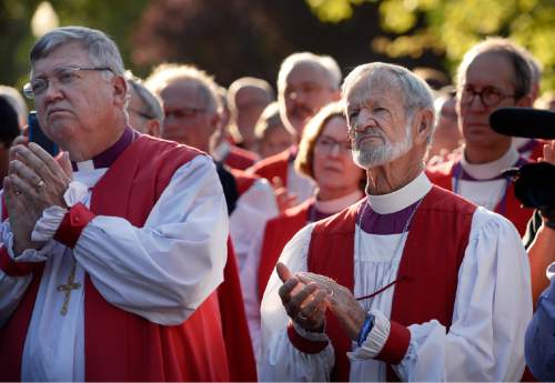 Scott Sommerdorf   |  The Salt Lake Tribune
Episcopal bishops applaud speakers at a stop in Pioneer Park as they marched to protest gun violence. The march  by more than 60 Episcopal bishops and and about 2,000 in all, took place Sunday, June 28, 2015. The march started at The Salt Palace, went to Pioneer Park and returned to the Salt Palace - site of the General Convention of the Episcopal Church.