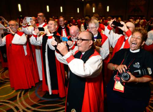 Scott Sommerdorf   |  The Salt Lake Tribune
Episcopal bishops scramble to take their own photos of a rare grouping of all 18 female Episcopal bishops at the General Convention of the Episcopal Church held at the Salt Palace, Sunday, June 28, 2015.