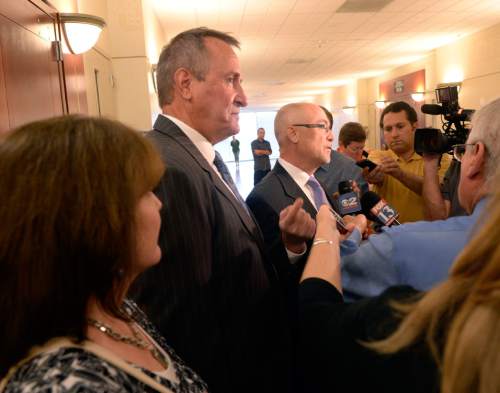 Al Hartmann  |  The Salt Lake Tribune

Former Utah Attorney General Mark Shurtleff faces the media with his lawyer Richard Van Wagoner after pleading not guilty to five felonies and two misdemeanors outside Judge Elizabeth Hruby-Mills courtroom in Salt Lake City on Monday, June 29, 2015. Shurtleff's wife M'Liss is at the left.