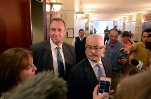 Al Hartmann  |  The Salt Lake Tribune

Former Utah Attorney General Mark Shurtleff faces the media with his lawyer Richard Van Wagoner after pleading not guilty to five felonies and two misdemeanors outside Judge Elizabeth Hruby-Mills courtroom in Salt Lake City on Monday, June 29, 2015. Shurtleff's wife M'Liss is at the left.